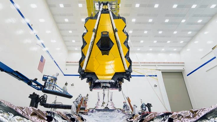 A view of NASA’s James Webb Space Telescope OTIS, being lowered on the SCE to become a fully assembled observatory at Northrop Grumman in Redondo Beach, California. 