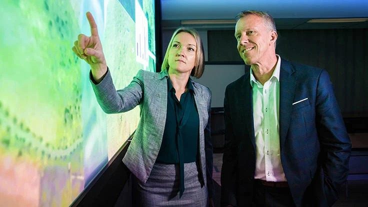 Emily Hughes, chief engineer for Boeing Phantom Works International discussing the AI project with Professor Jason Scholz, Trusted Autonomous Systems Defence Cooperative Research Centre. 