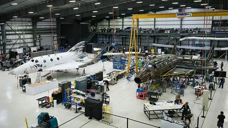 Virgin Galactic’s next SpaceShipTwo being assembeld in September 2019 (right), next to VSS Unity.