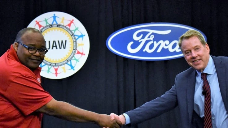 UAW President Rory Gamble (left) shakes hands with Ford Motor Co. Executive Chairman Bill Ford at the start of 2019 labor negotiations.