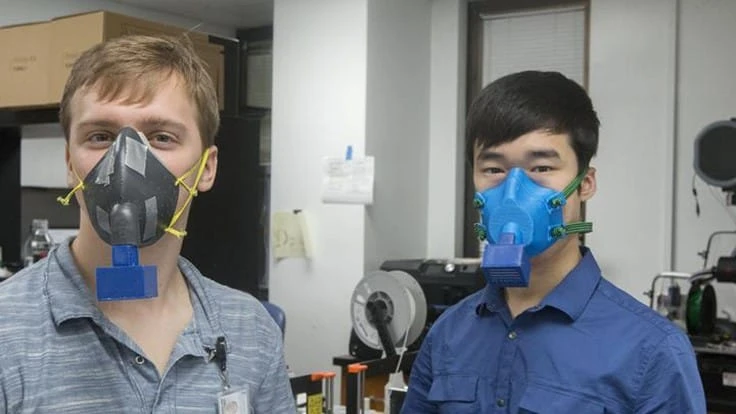 John Yost and Joshua Kim model the first and second prototypes of the 3D printed masks created by a multidisciplinary team at MUSC.
