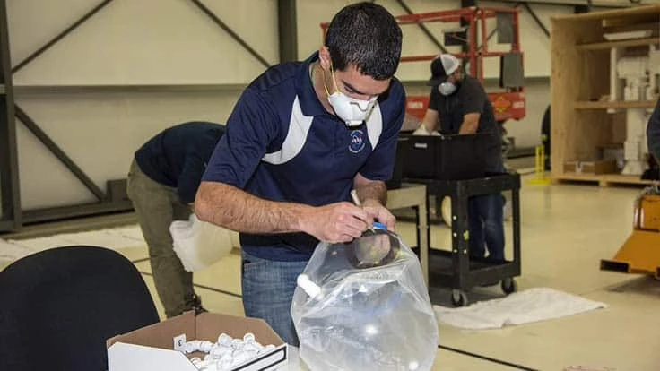 An employee works on the Aerospace Valley Positive Pressure Helmet