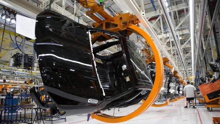 Workers assemble pickups at FCA's Sterling Heights Assembly Plant near Detroit in this 2019 file photo. FCA hopes to restart that plant and others starting May 18.