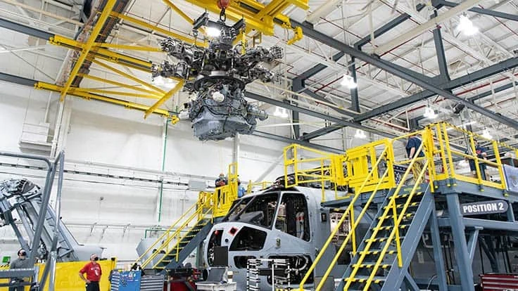 Newly-installed 10-ton cranes lift a 12,000 lb. gearbox into a CH-53K heavy-lift helicopter on Sikorsky’s final assembly line in Stratford, Connecticut on Oct. 19, 2020. 