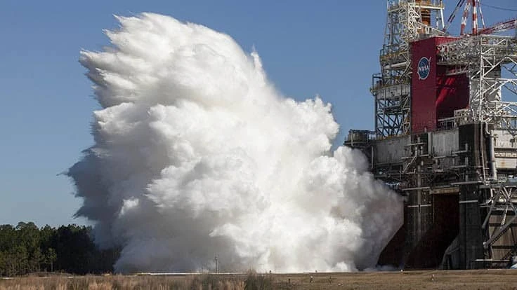 Steam billows from under the B-2 Test Stand at NASA’s Stennis Space Center in Mississippi as Boeing and NASA conduct a hot fire test of the core stage for the agency’s first Space Launch System rocket on March 18, 2021. 