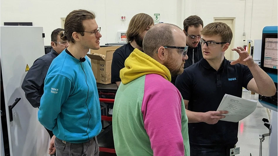 The inaugural class in the INDEX Technician Development Program participates in a learning session on the shop floor.