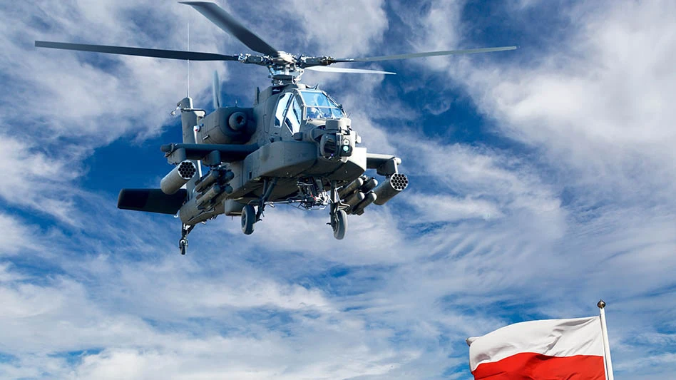 military helicopter in flight with flag of poland