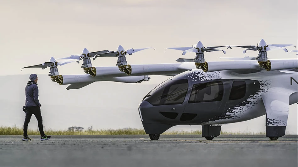 Man walking toward the front of an evtol aircraft