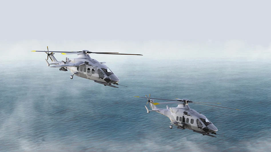 two helicopters in flight over a foggy sea