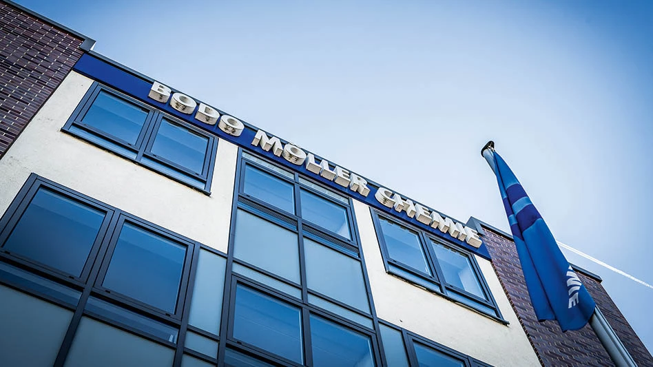looking up at the facade of an office building