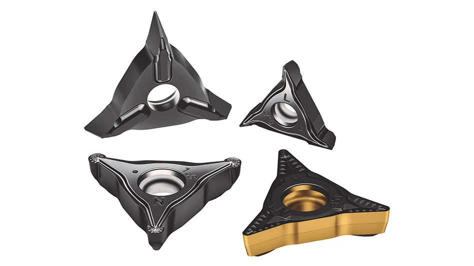 four triangular cutting tool inserts