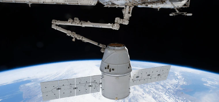 Taken by crew members aboard the International Space Station, capture and docking of the SpaceX Dragon.